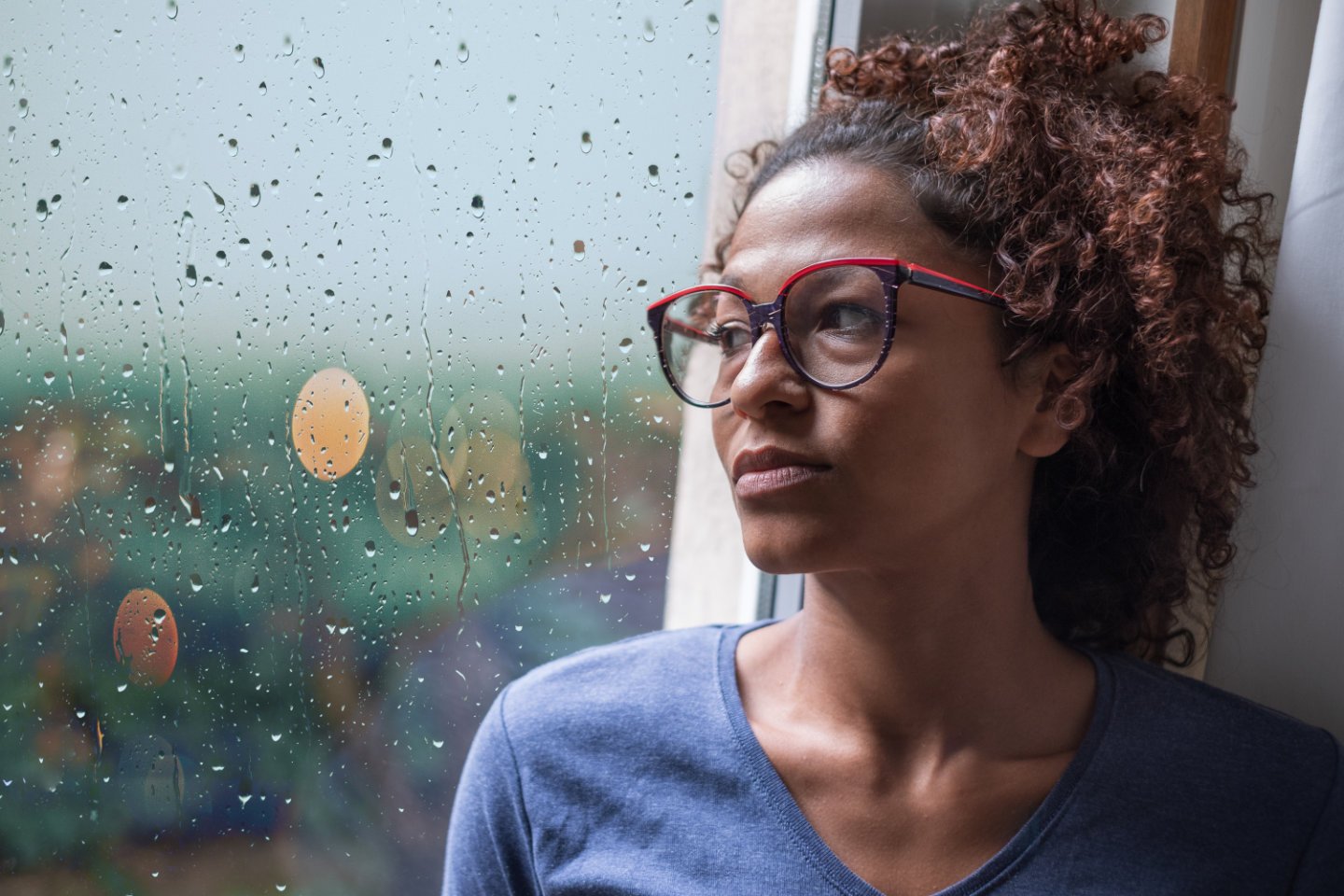 Woman staring out the window